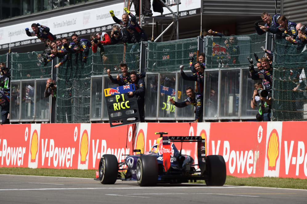 Race winner Daniel Ricciardo (AUS) Red Bull Racing RB10 crosses the line