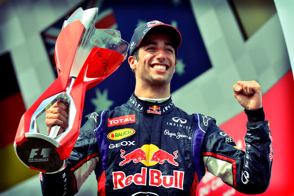 Race winner Daniel Ricciardo (AUS) Red Bull Racing celebrates on the podium with the trophy