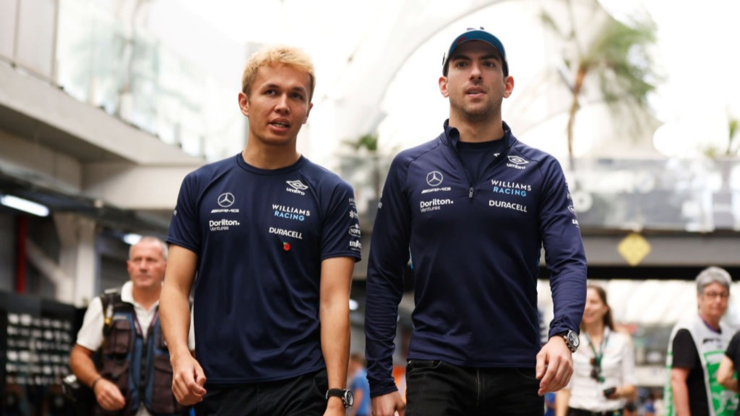 SAO PAULO, BRAZIL - NOVEMBER 11: Alexander Albon of Thailand and Williams and Nicholas Latifi of Canada and Williams walk in the Paddock prior to practice ahead of the F1 Grand Prix of Brazil at Autodromo Jose Carlos Pace on November 11, 2022 in Sao Paulo, Brazil. (Photo by Jared C. Tilton/Getty Images)