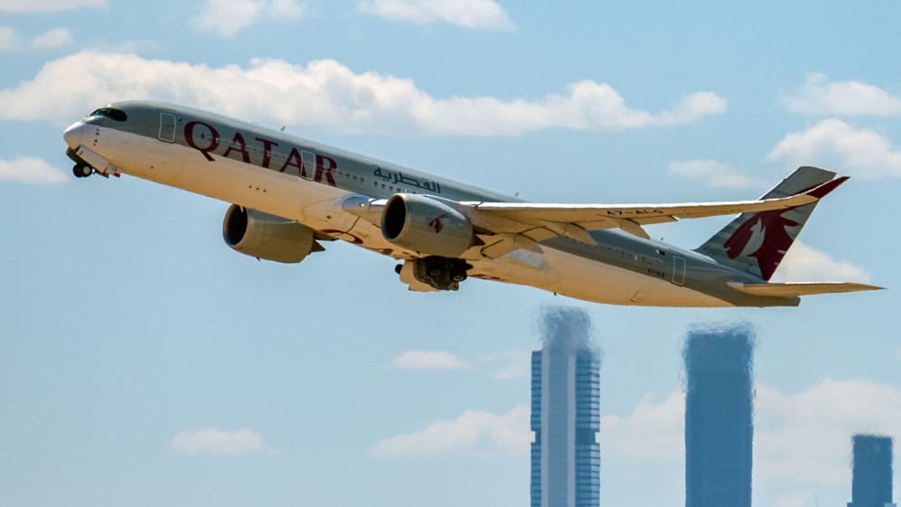 MADRID, SPAIN - 2022/06/03: Qatar Airways airplane takes off from Madrid Adolfo Suarez Airport passing by the skyscrapers of the business area of Madrid. (Photo by Marcos del Mazo/LightRocket via Getty Images)